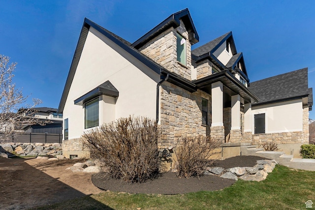 6264 W Skyline Dr N, Highland, UT 84003 - view of side of home with stucco siding and stone siding