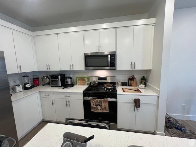 933 N 960 W Street W W 4, Tremonton, UT 84337 - kitchen with light countertops, white cabinets, and stainless steel appliances