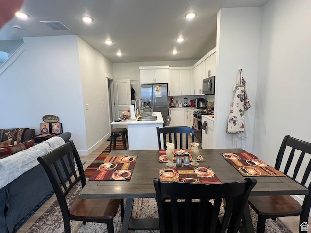 933 N 960 W Street W W 4, Tremonton, UT 84337 - dining room with baseboards, visible vents, light wood-style flooring, and recessed lighting