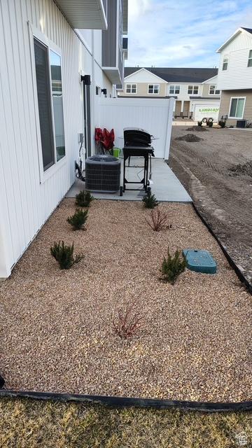 933 N 960 W Street W W 4, Tremonton, UT 84337 - view of yard featuring central AC unit, fence, and a patio area