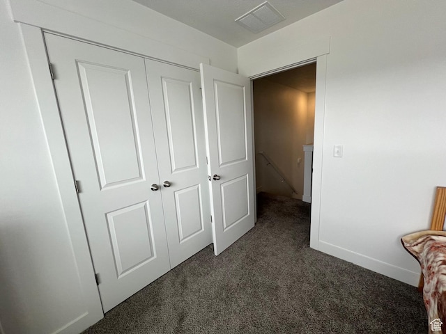 933 N 960 W Street W W 4, Tremonton, UT 84337 - unfurnished bedroom with a closet, baseboards, dark colored carpet, and visible vents