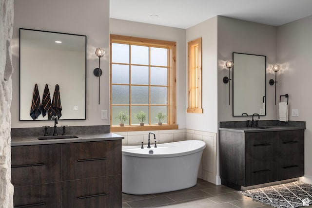 915 Farrell Farm Cir, Midway, UT 84049 - full bathroom with a sink, a freestanding bath, two vanities, and tile patterned flooring