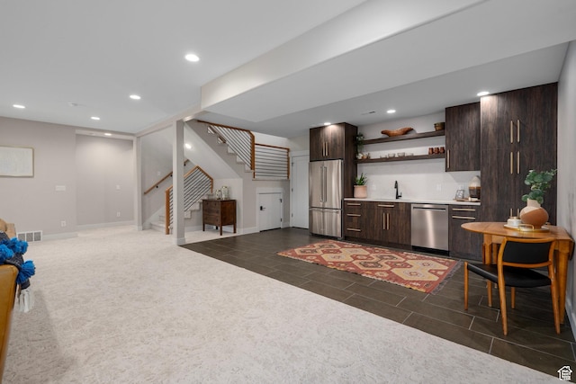 915 Farrell Farm Cir, Midway, UT 84049 - kitchen with open shelves, recessed lighting, stainless steel appliances, light countertops, and dark brown cabinets