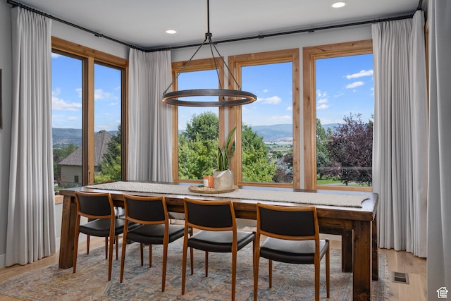 915 Farrell Farm Cir, Midway, UT 84049 - dining room with a mountain view, a healthy amount of sunlight, and wood finished floors