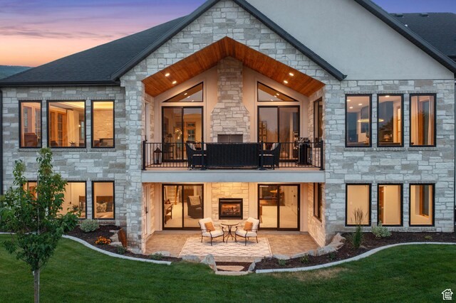 915 Farrell Farm Cir, Midway, UT 84049 - back of property with a balcony, a patio area, and stone siding