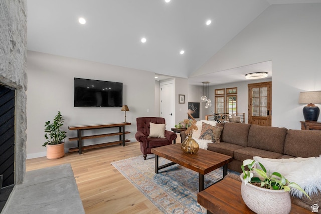 915 Farrell Farm Cir, Midway, UT 84049 - living area with recessed lighting, high vaulted ceiling, a fireplace, and light wood finished floors