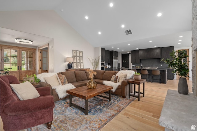 915 Farrell Farm Cir, Midway, UT 84049 - living room with visible vents, high vaulted ceiling, recessed lighting, light wood-style floors, and french doors