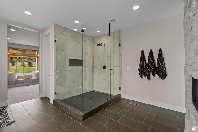 915 Farrell Farm Cir, Midway, UT 84049 - bathroom with visible vents, ensuite bathroom, a shower stall, tile patterned flooring, and baseboards