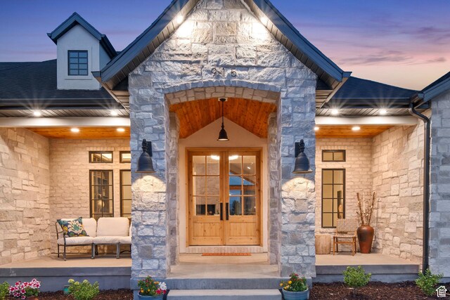 915 Farrell Farm Cir, Midway, UT 84049 - doorway to property with a porch, stone siding, and roof with shingles
