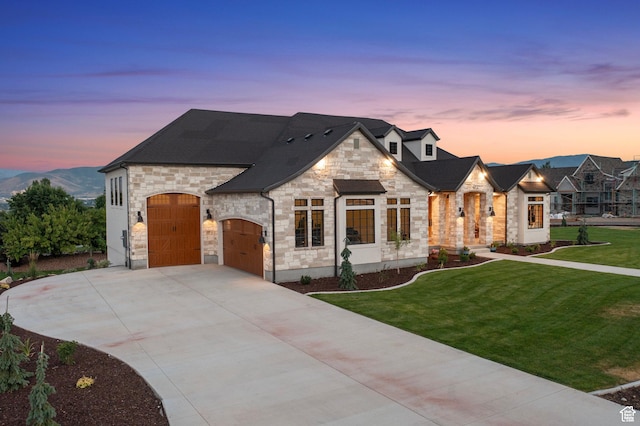 915 Farrell Farm Cir, Midway, UT 84049 - french country style house with a yard, stone siding, a garage, and driveway