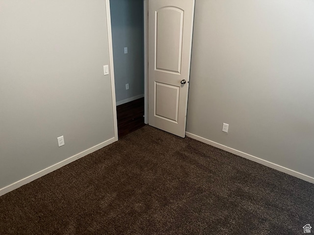 223 E Jordan Ridge Blvd Unit 110, Saratoga Springs, UT 84045 - empty room with baseboards and dark carpet
