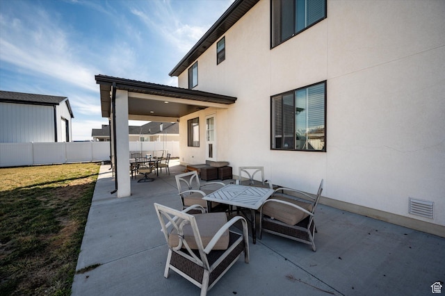 1490 N 4925 W, Plain City, UT 84404 - view of patio with outdoor dining area, fence, and visible vents