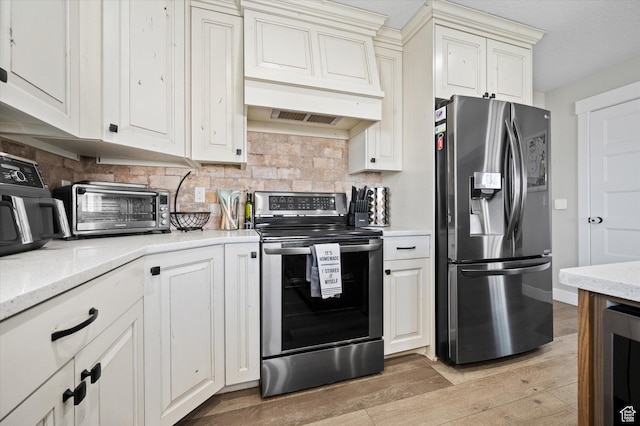 1490 N 4925 W, Plain City, UT 84404 - kitchen featuring beverage cooler, a toaster, stainless steel appliances, and light wood-style floors