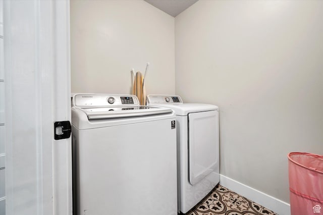 1490 N 4925 W, Plain City, UT 84404 - clothes washing area featuring washer and clothes dryer, laundry area, and baseboards