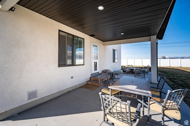 1490 N 4925 W, Plain City, UT 84404 - view of patio / terrace with outdoor dining space, visible vents, and fence