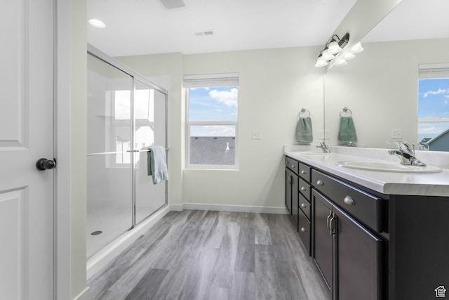 1843 E 970 N, Spanish Fork, UT 84660 - bathroom featuring double vanity, visible vents, a sink, and wood finished floors