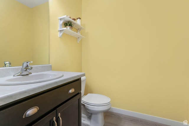 1843 E 970 N, Spanish Fork, UT 84660 - bathroom with vanity, baseboards, toilet, and wood finished floors