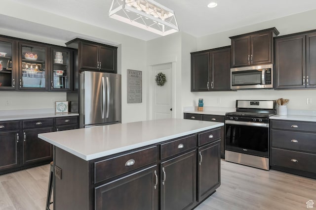 1843 E 970 N, Spanish Fork, UT 84660 - kitchen with light countertops, light wood-style flooring, appliances with stainless steel finishes, and a kitchen island