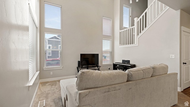 1606 N 4230 W, Lehi, UT 84043 - living room with a towering ceiling, visible vents, baseboards, and carpet floors