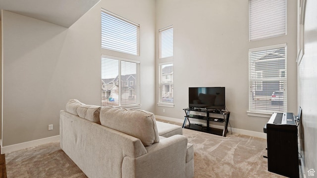 1606 N 4230 W, Lehi, UT 84043 - living room with baseboards, light colored carpet, and a towering ceiling