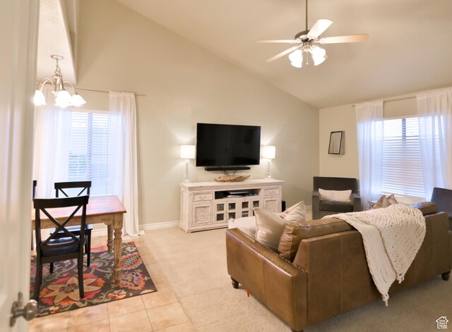 3131 E River Bottoms Rd S, Spanish Fork, UT 84660 - living area with tile patterned floors, high vaulted ceiling, carpet floors, baseboards, and ceiling fan with notable chandelier