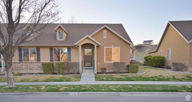 3131 E River Bottoms Rd S, Spanish Fork, UT 84660 - view of front of property with a front lawn, stucco siding, and roof with shingles