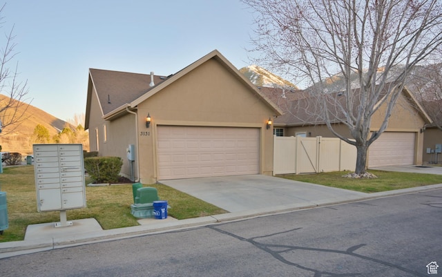 3131 E River Bottoms Rd S, Spanish Fork, UT 84660 - single story home with concrete driveway, stucco siding, fence, an attached garage, and a front yard