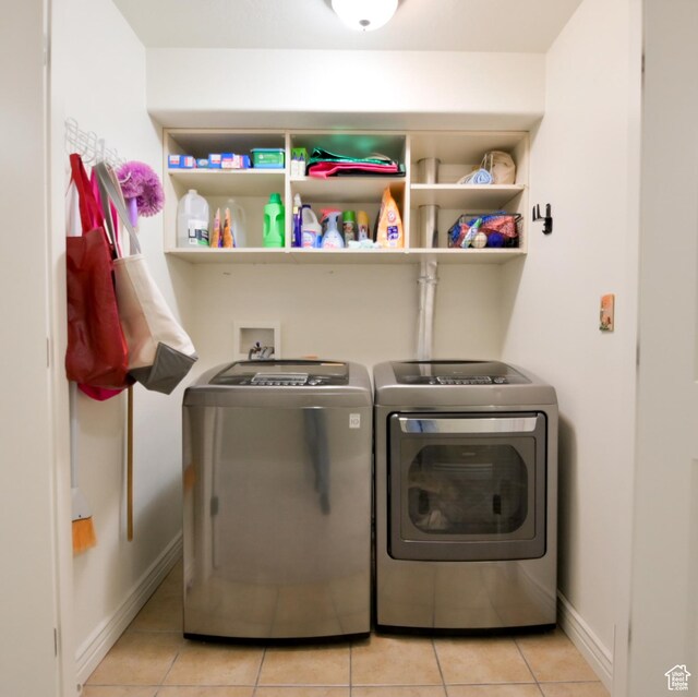 3131 E River Bottoms Rd S, Spanish Fork, UT 84660 - laundry room with light tile patterned floors, baseboards, washer and dryer, and laundry area