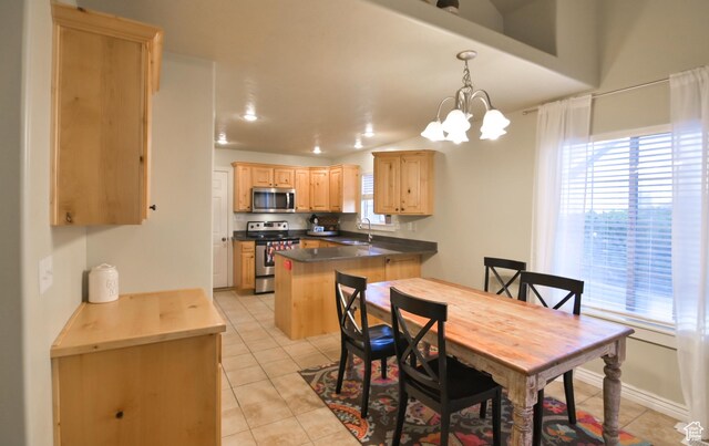 3131 E River Bottoms Rd S, Spanish Fork, UT 84660 - dining space featuring light tile patterned floors, a notable chandelier, and a wealth of natural light