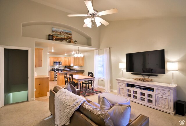3131 E River Bottoms Rd S, Spanish Fork, UT 84660 - living room featuring baseboards, high vaulted ceiling, a ceiling fan, and light colored carpet