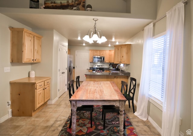 3131 E River Bottoms Rd S, Spanish Fork, UT 84660 - dining space featuring light tile patterned flooring, a notable chandelier, baseboards, and a healthy amount of sunlight