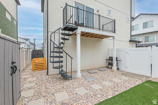 53 E Polaris Dr, Saratoga Springs, UT 84045 - view of patio / terrace with grilling area, a fenced backyard, stairs, and a gate