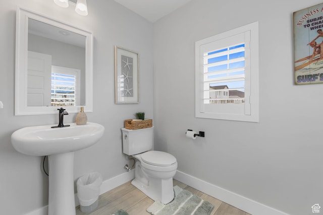 53 E Polaris Dr, Saratoga Springs, UT 84045 - bathroom featuring baseboards, toilet, and wood finished floors