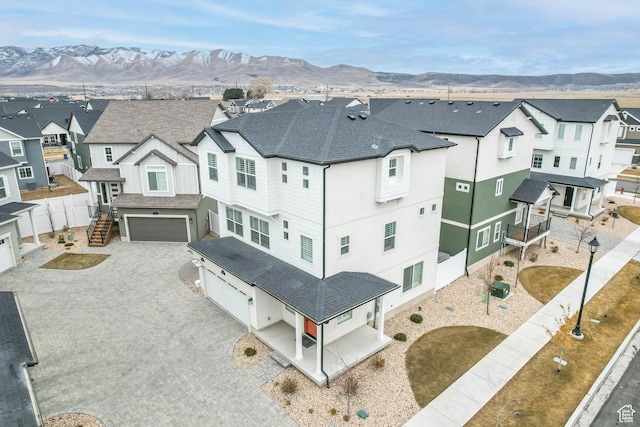 drone / aerial view with a mountain view and a residential view