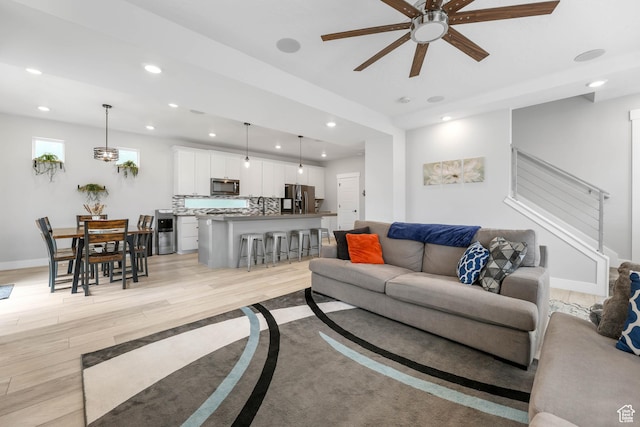 53 E Polaris Dr, Saratoga Springs, UT 84045 - living room featuring recessed lighting, baseboards, light wood-style flooring, and a ceiling fan