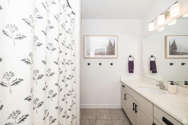 198 W Box Creek Dr, Stansbury Park, UT 84074 - full bath featuring curtained shower, baseboards, tile patterned flooring, and vanity