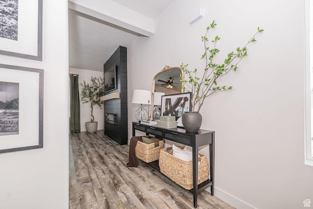 198 W Box Creek Dr, Stansbury Park, UT 84074 - hallway featuring beamed ceiling, baseboards, and wood finished floors