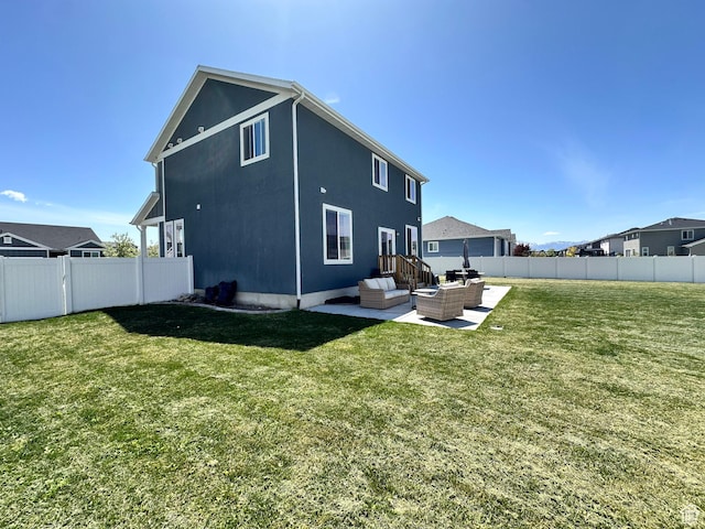 198 W Box Creek Dr, Stansbury Park, UT 84074 - back of house featuring a fenced backyard, outdoor lounge area, a yard, and a patio