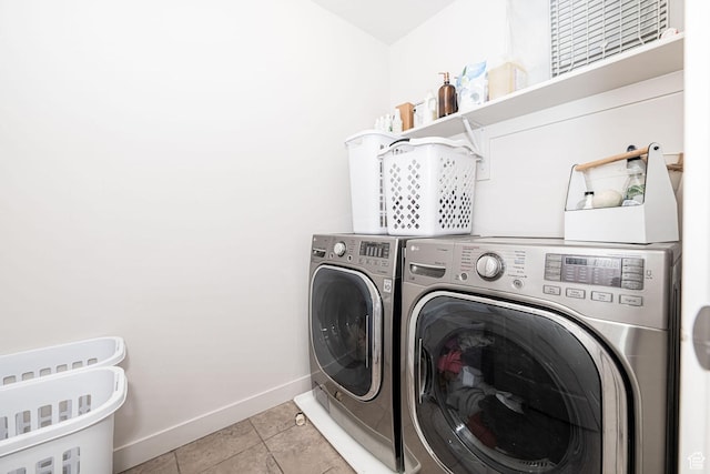 198 W Box Creek Dr, Stansbury Park, UT 84074 - clothes washing area with light tile patterned flooring, baseboards, separate washer and dryer, and laundry area