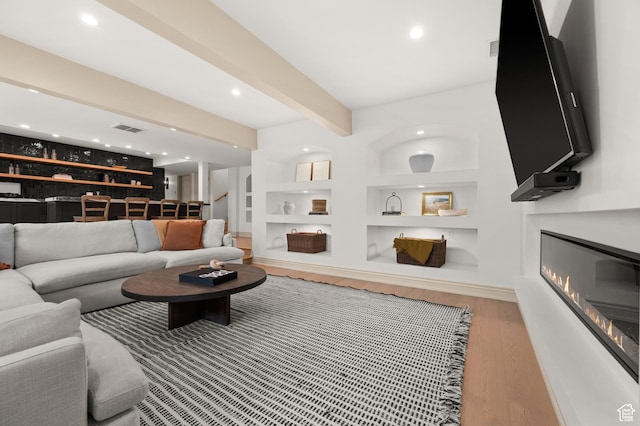 2651 E Hiawatha Cir, Salt Lake City, UT 84108 - living room with built in features, wood finished floors, visible vents, beam ceiling, and stairs