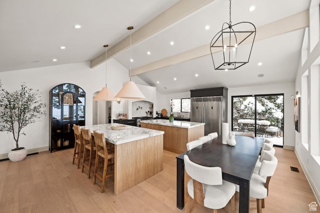 2651 E Hiawatha Cir, Salt Lake City, UT 84108 - dining room with lofted ceiling with beams, an inviting chandelier, and light wood-style flooring