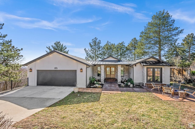 mid-century inspired home featuring french doors, fence, stucco siding, and a standing seam roof