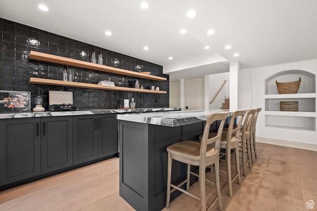 2651 E Hiawatha Cir, Salt Lake City, UT 84108 - bar featuring indoor wet bar, decorative backsplash, recessed lighting, and light wood-type flooring