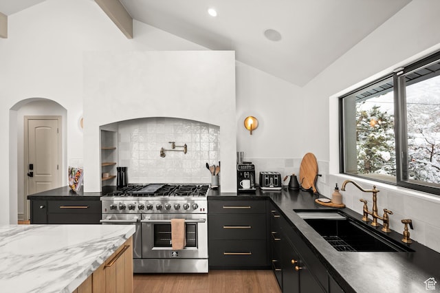 2651 E Hiawatha Cir, Salt Lake City, UT 84108 - kitchen featuring vaulted ceiling, a sink, light wood-style floors, and range with two ovens