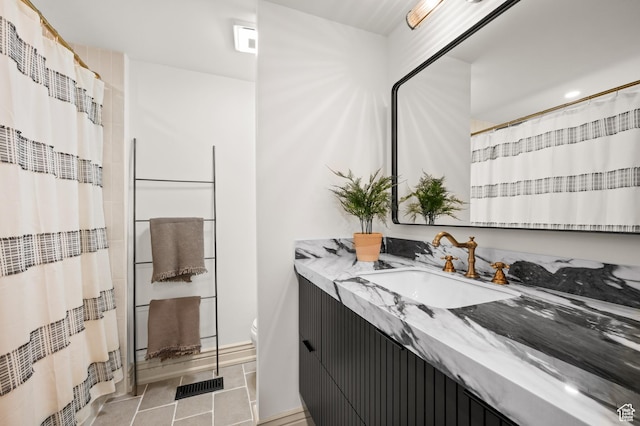 2651 E Hiawatha Cir, Salt Lake City, UT 84108 - full bathroom with vanity, visible vents, tile patterned flooring, curtained shower, and toilet