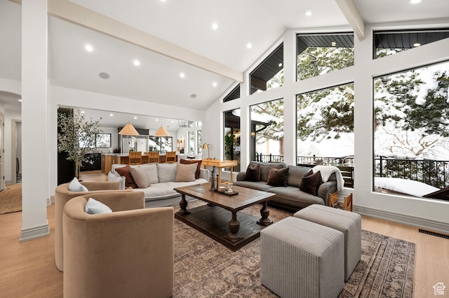 2651 E Hiawatha Cir, Salt Lake City, UT 84108 - living room with a wealth of natural light, visible vents, light wood-style flooring, and beam ceiling