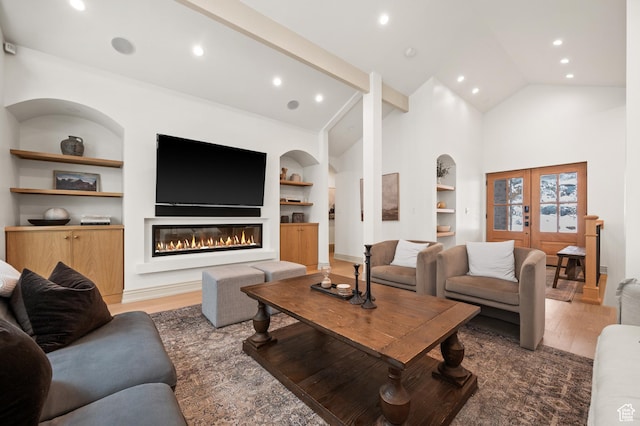 2651 E Hiawatha Cir, Salt Lake City, UT 84108 - living room with light wood finished floors, built in features, recessed lighting, and a glass covered fireplace