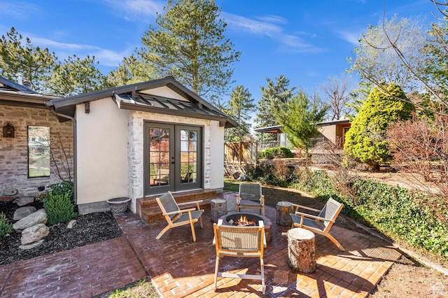 2651 E Hiawatha Cir, Salt Lake City, UT 84108 - view of patio featuring french doors, fence, and an outdoor fire pit