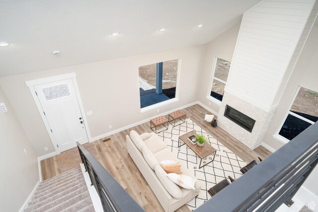 2678 S Eagle Dr Unit 12, Garden City, UT 84028 - living room featuring recessed lighting, wood finished floors, baseboards, and a glass covered fireplace