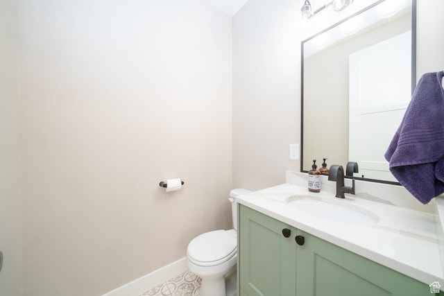 2678 S Eagle Dr Unit 12, Garden City, UT 84028 - bathroom with toilet, baseboards, and vanity